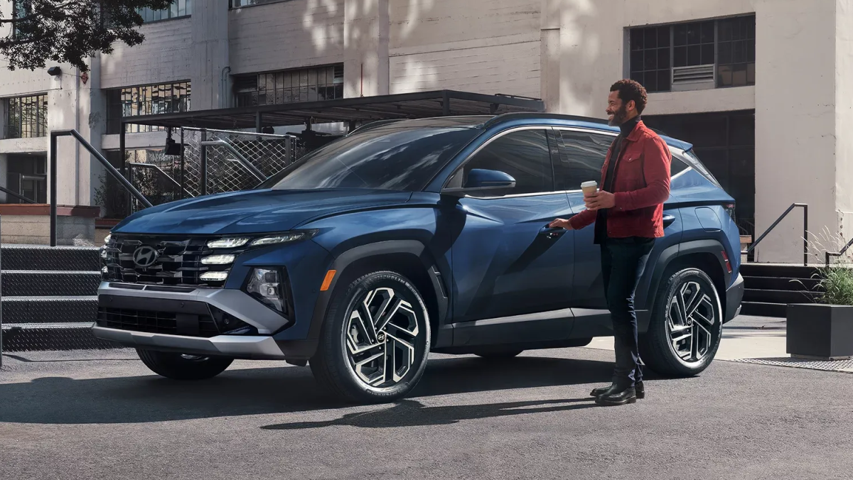 Front side hero view of a 2026 Hyundai Tucson parked on a city street
