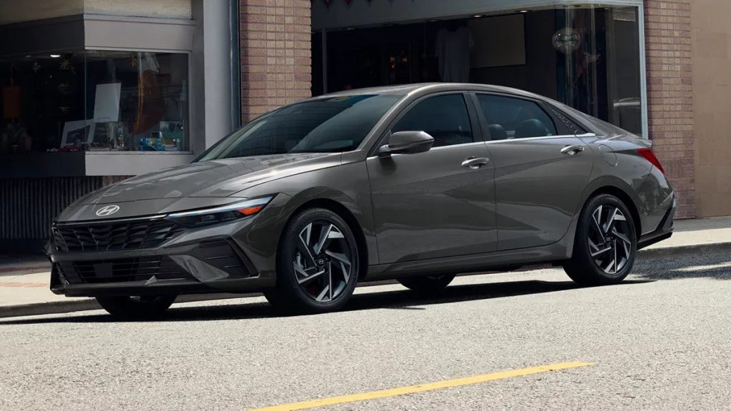 Ecotronic Gray exterior 2026 ELANTRA Hybrid parked on a city street. 