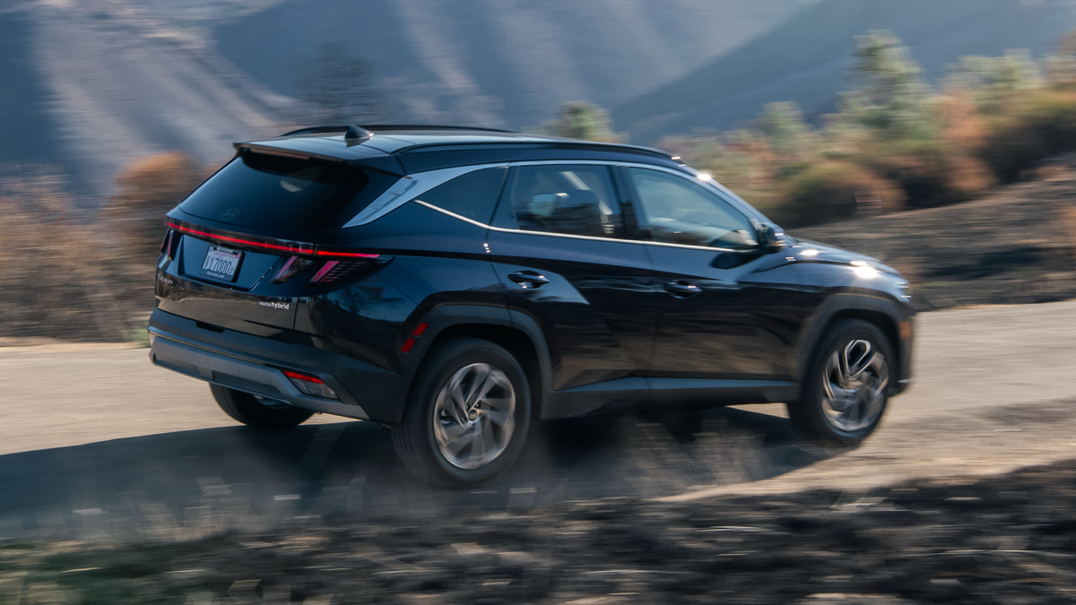 2026 Hyundai Tucson Hybrid rear side view driving