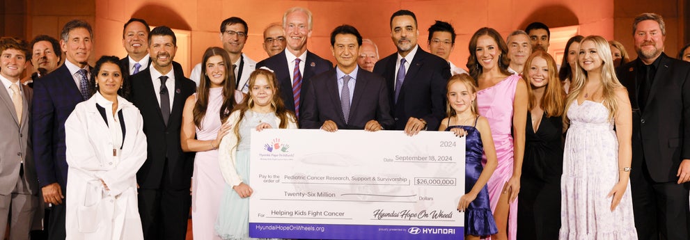 helping kids fight cancer foundation showing their big check from hyundai hope on wheels - Hyundai of Downtown Los Angeles in Los Angeles CA
